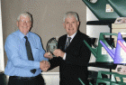 Joe Lydon (r) receives the ‘Agent of the Year’ award from operations director, Tony Dedman